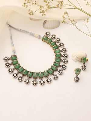 Flat lay of mint doublet kundan choker in Victorian finish with matching delicate earrings