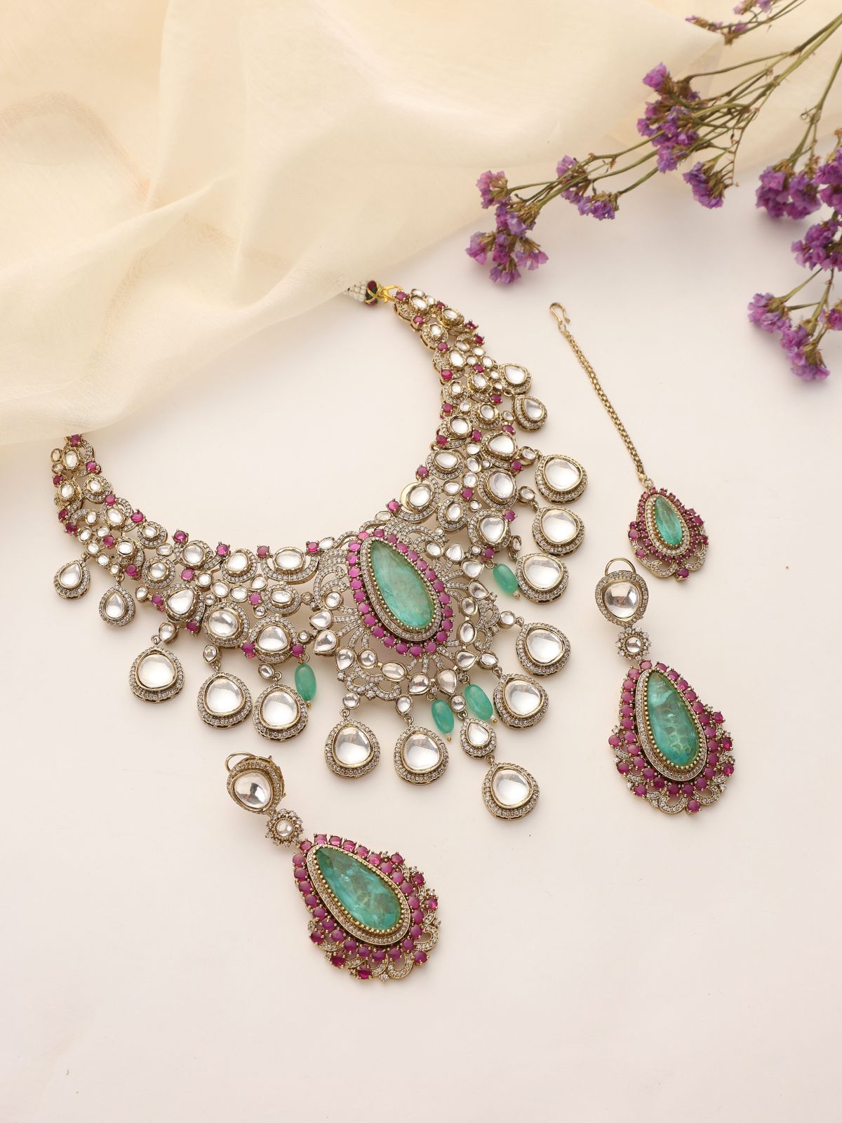 Ameira Kundan Polki Necklace Set with Green & Ruby Accents (with Earrings & Maang Tikka)