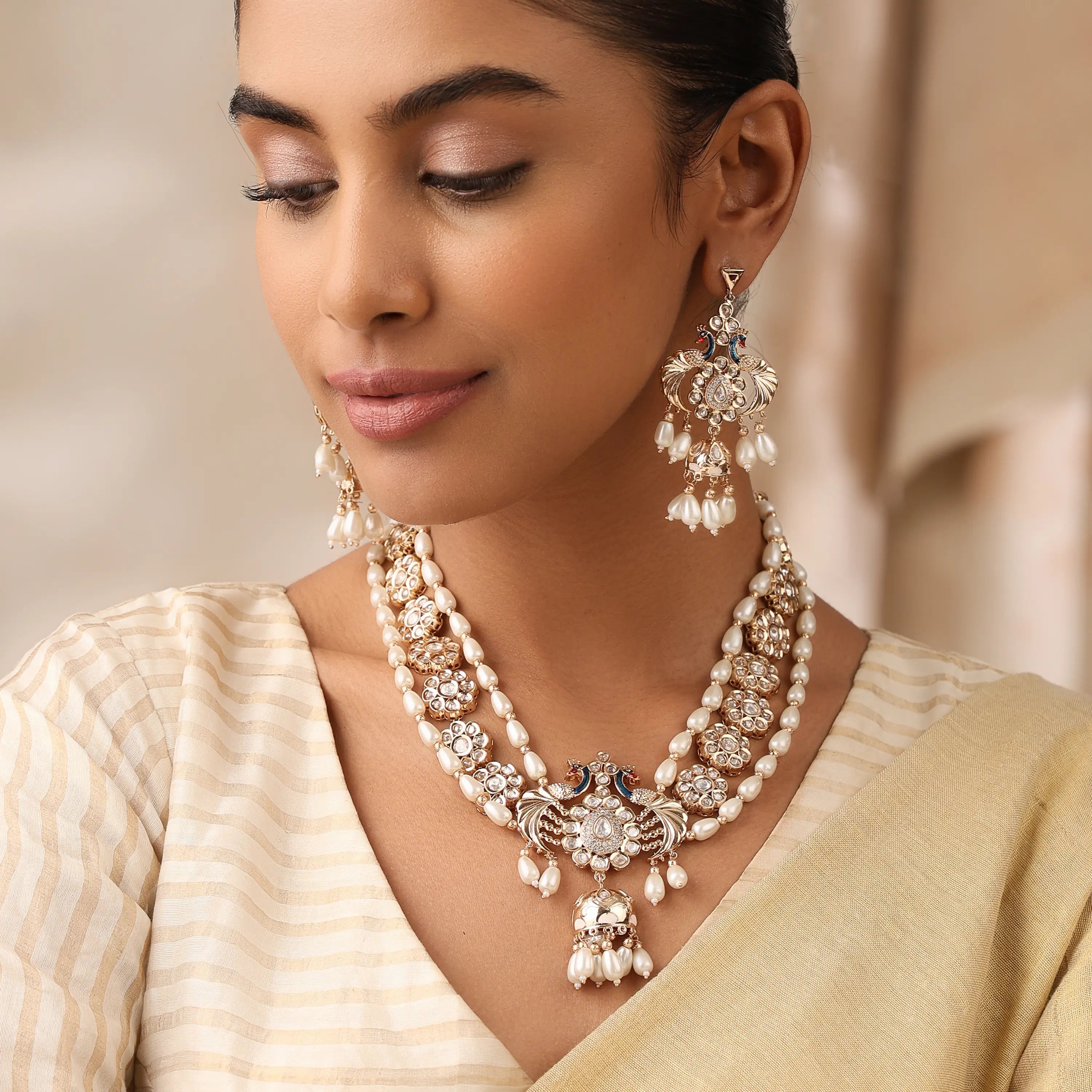 Layered Pearl Kundan Necklace with Peacock Motif & Statement Earrings