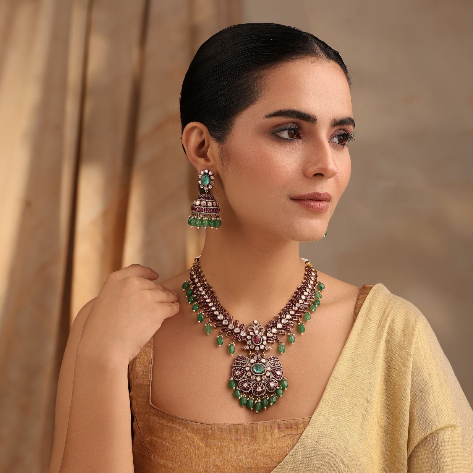 Regal Emerald Ruby Kundan Necklace with Jhumka Earrings in Antique Gold Finish