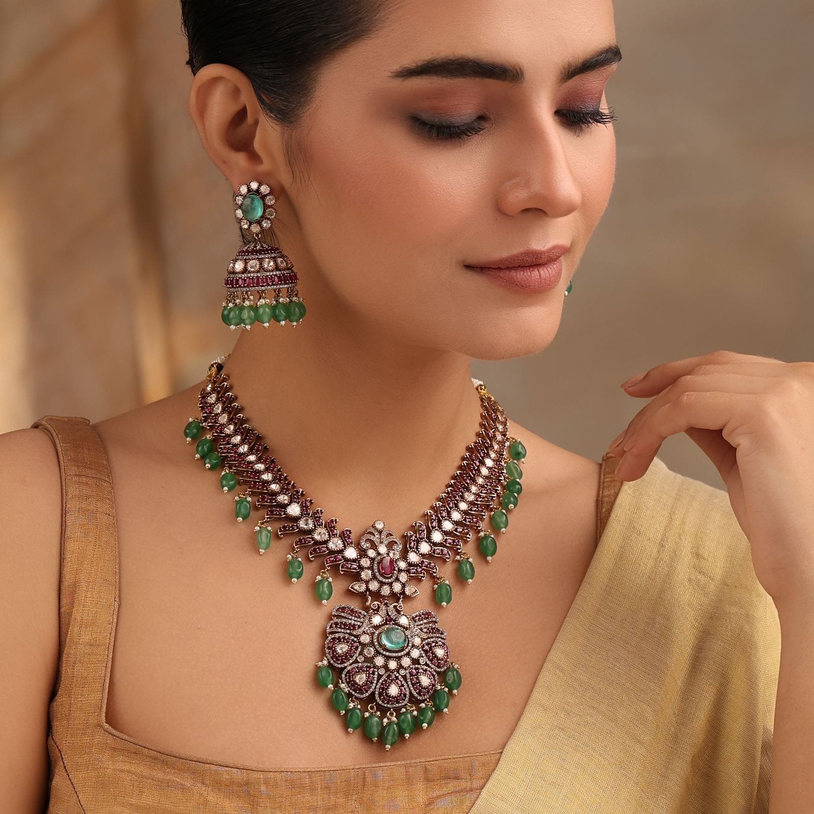 Regal Emerald Ruby Kundan Necklace with Jhumka Earrings in Antique Gold Finish