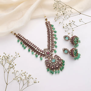 Regal Emerald Ruby Kundan Necklace with Jhumka Earrings in Antique Gold Finish