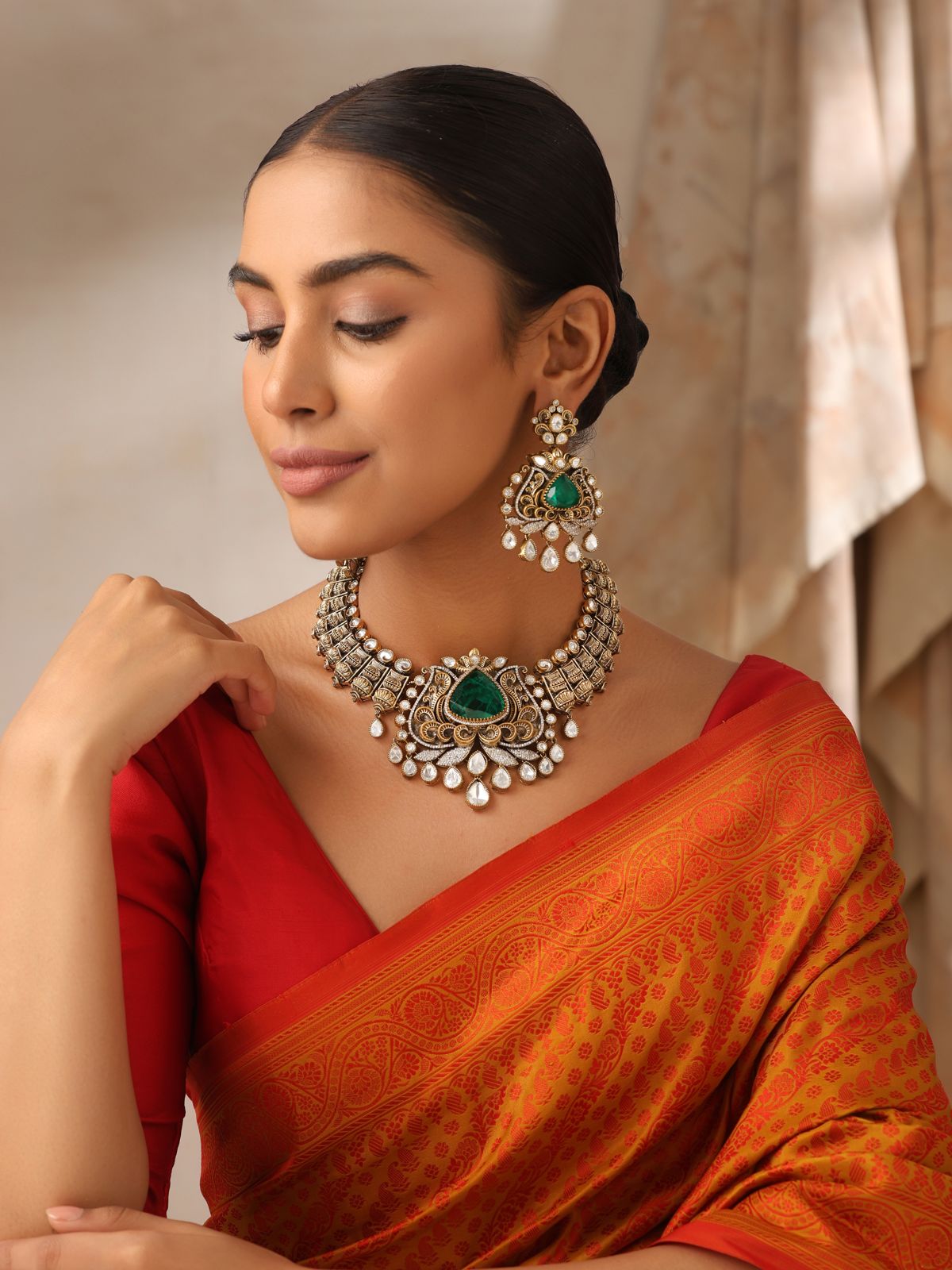 Model wearing Emerald Antique Kundan Choker Necklace with earrings