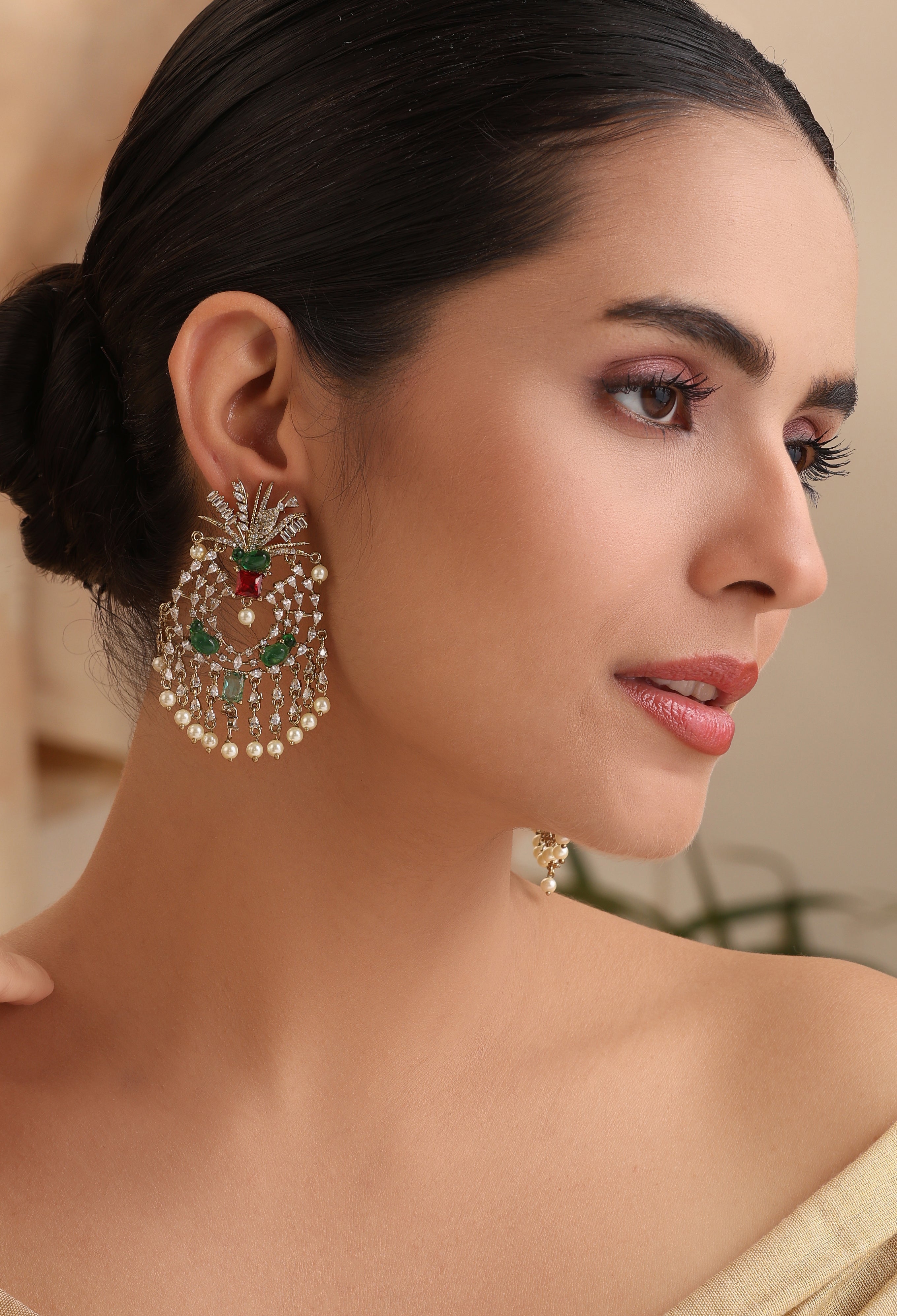 Model wearing Elara Emerald Pearl Chandelier Earrings with kundan stones, emerald accents, and pearl drops – MyRivaaz.