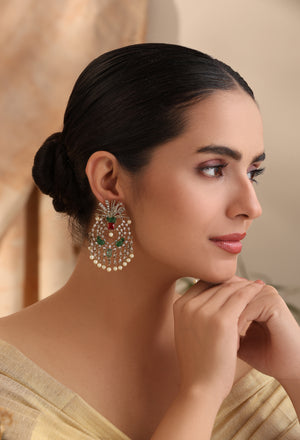 Side profile of Elara Emerald Pearl Chandelier Earrings showing cascading pearls and green stone accents – MyRivaaz.