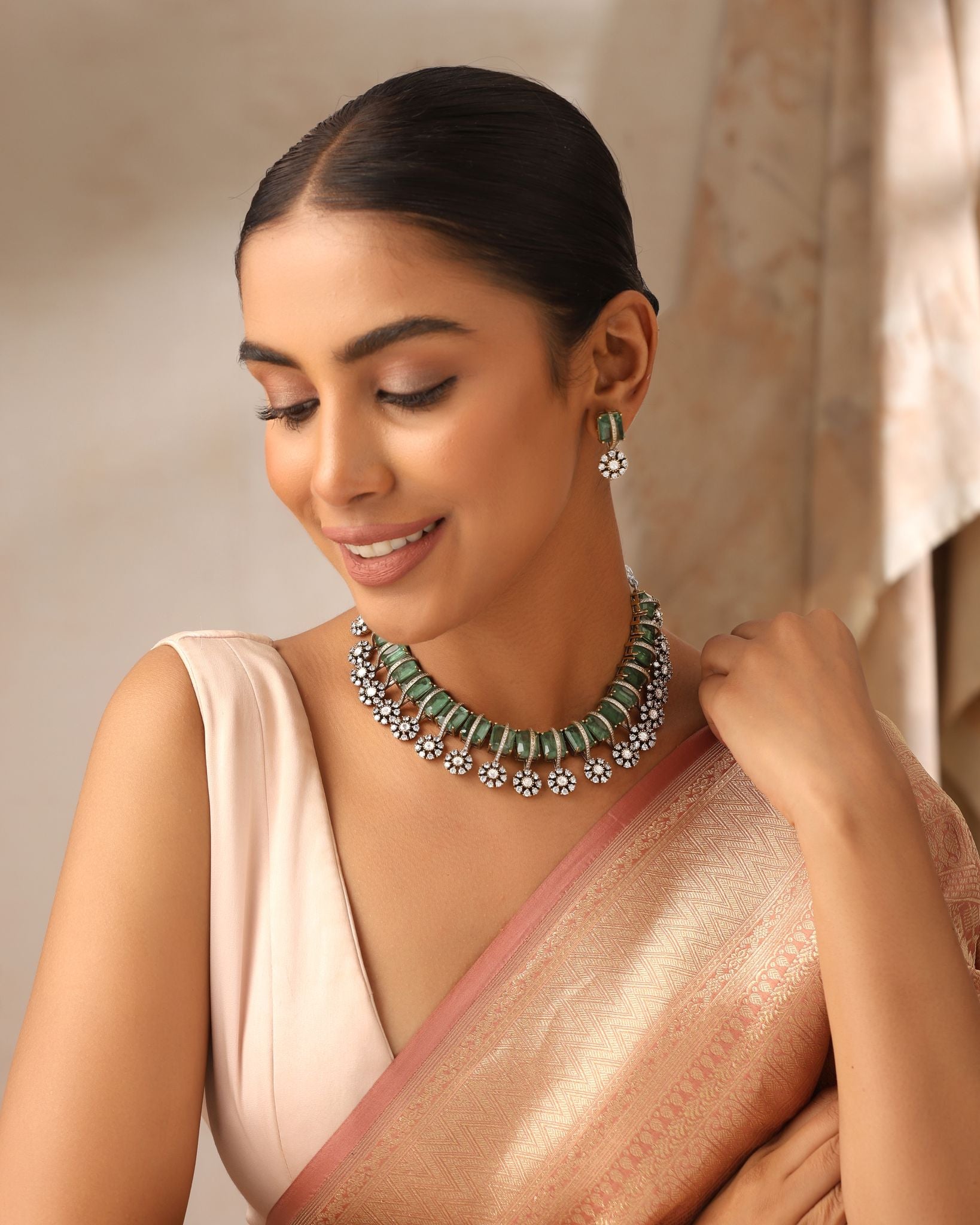 Close-up of mint doublet choker with moissanite kundan detailing and matching earrings