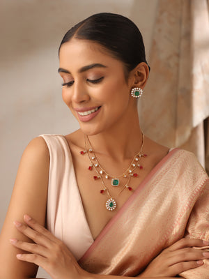 Model smiling in Emerald & Ruby Layered Kundan Necklace Set