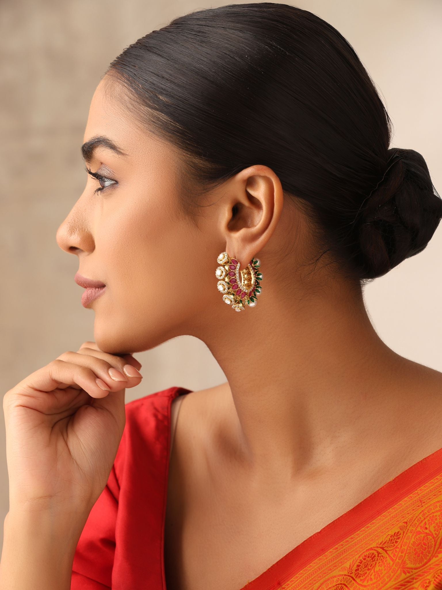 Kundan hoop earrings featuring red stones, CZ sparkle, and pearl drops.