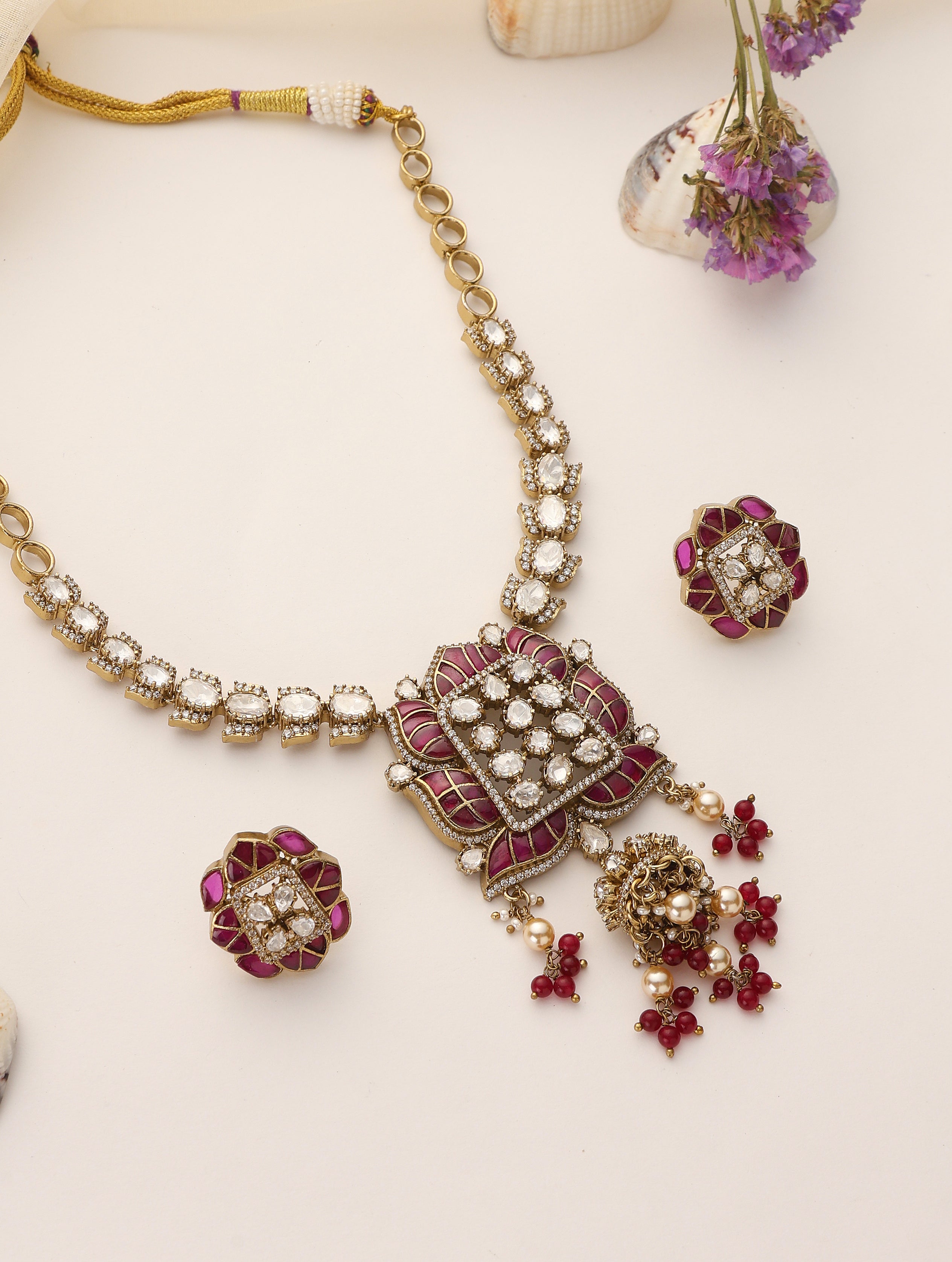 Long moissanite ruby necklace set with antique gold finish and matching stud earrings
