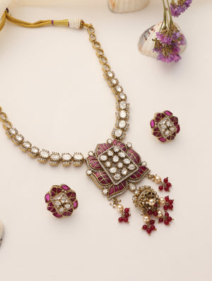 Long moissanite ruby necklace set with antique gold finish and matching stud earrings
