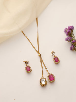 Flatlay of Dual Stone Ruby & Polki Pendant Set with Earrings – Gold Plated