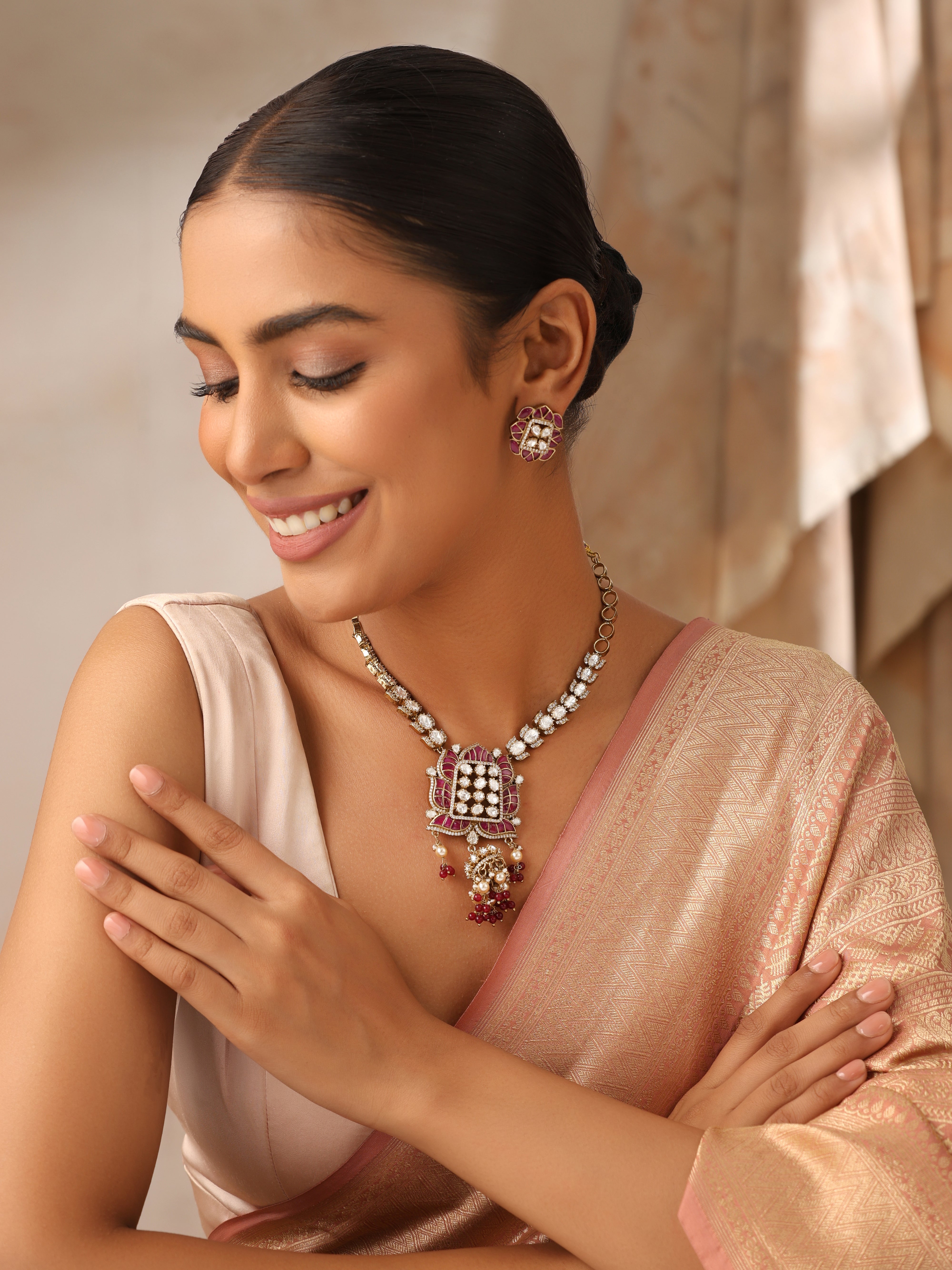 Long moissanite ruby necklace set with antique gold finish and matching stud earrings
