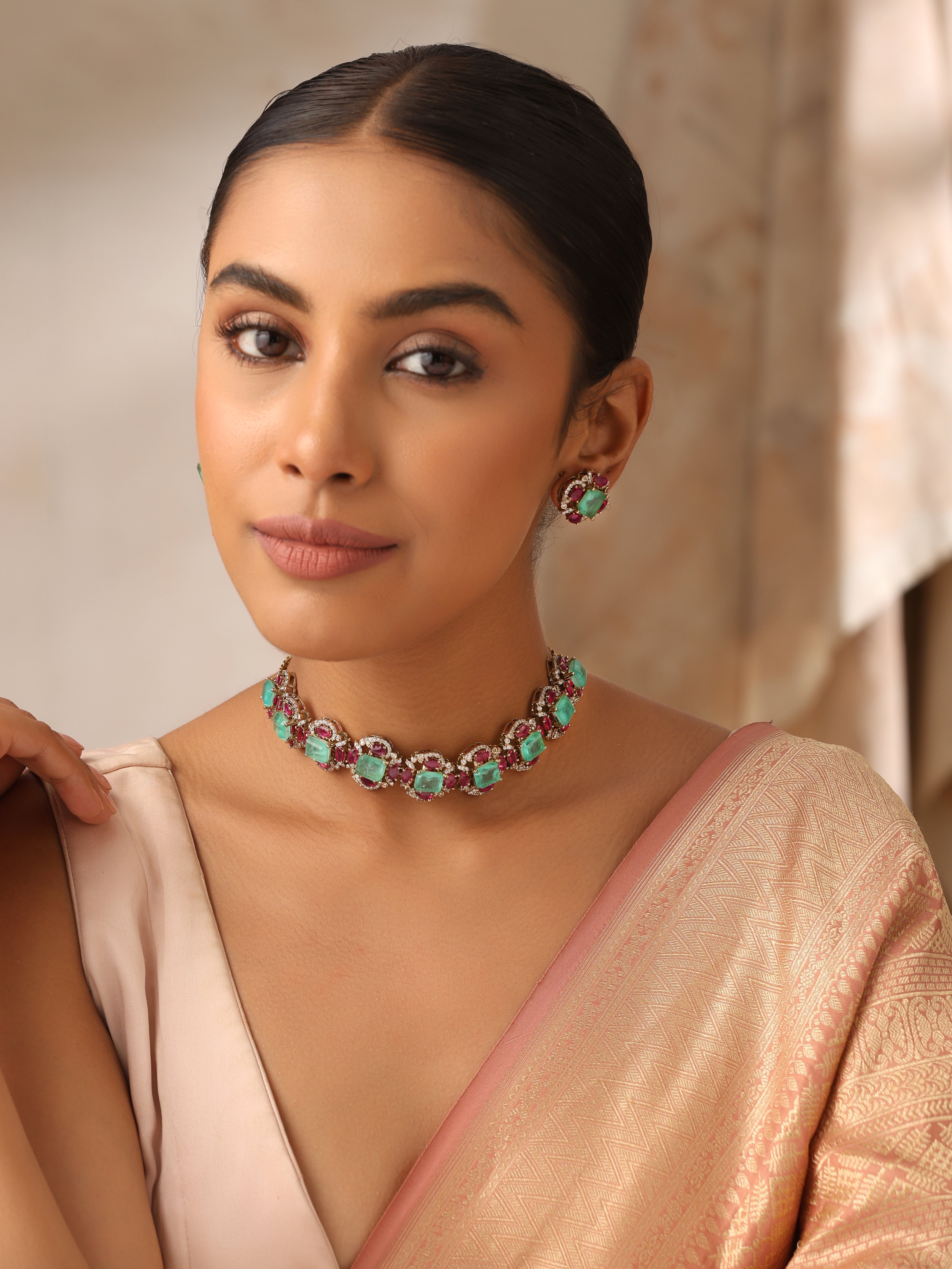 Side view of Emerald Paraiba choker necklace with ruby stones – luxury Indian wedding jewelry set