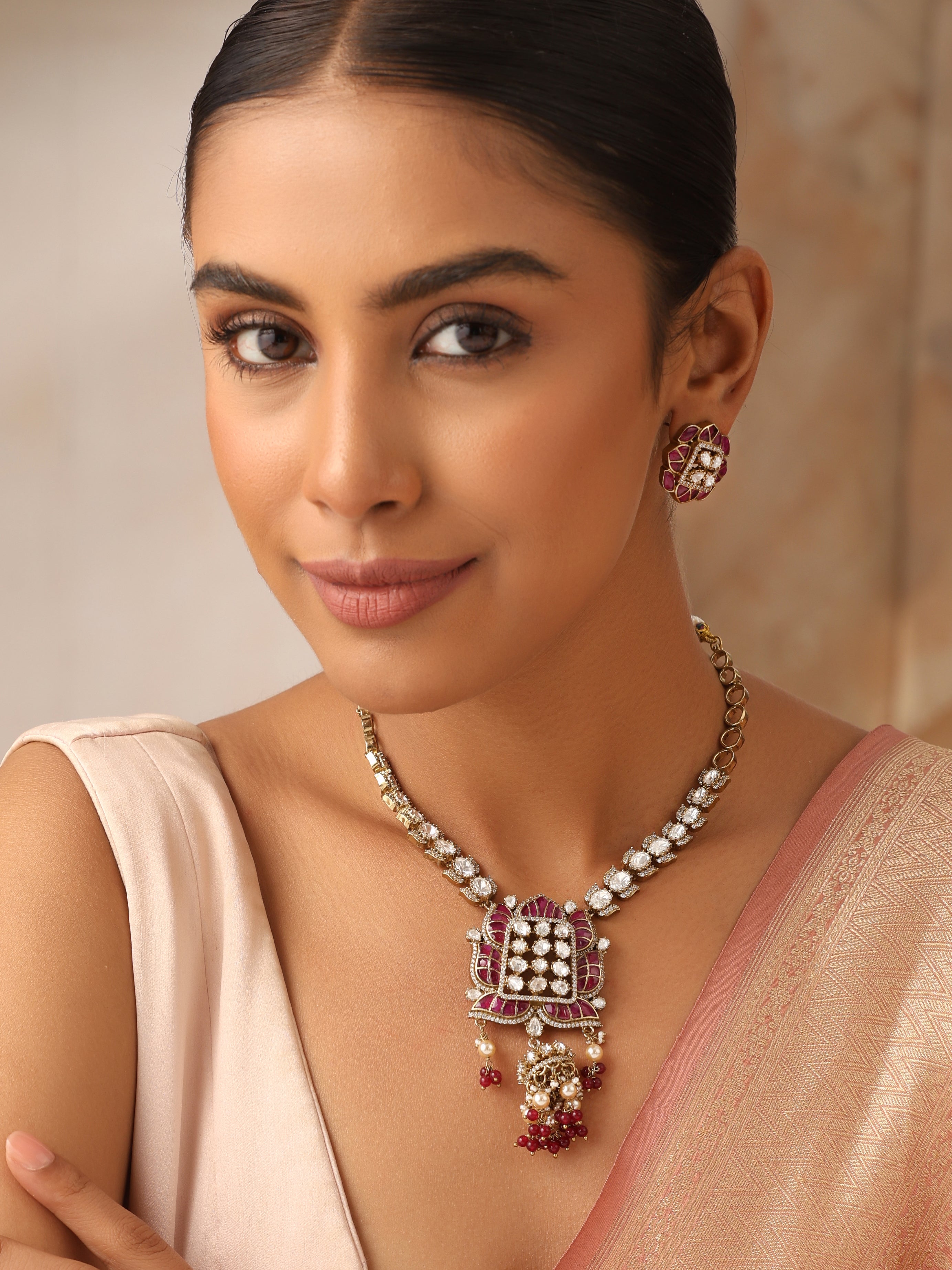 Long moissanite ruby necklace set with antique gold finish and matching stud earrings
