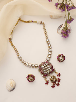 Long moissanite ruby necklace set with antique gold finish and matching stud earrings
