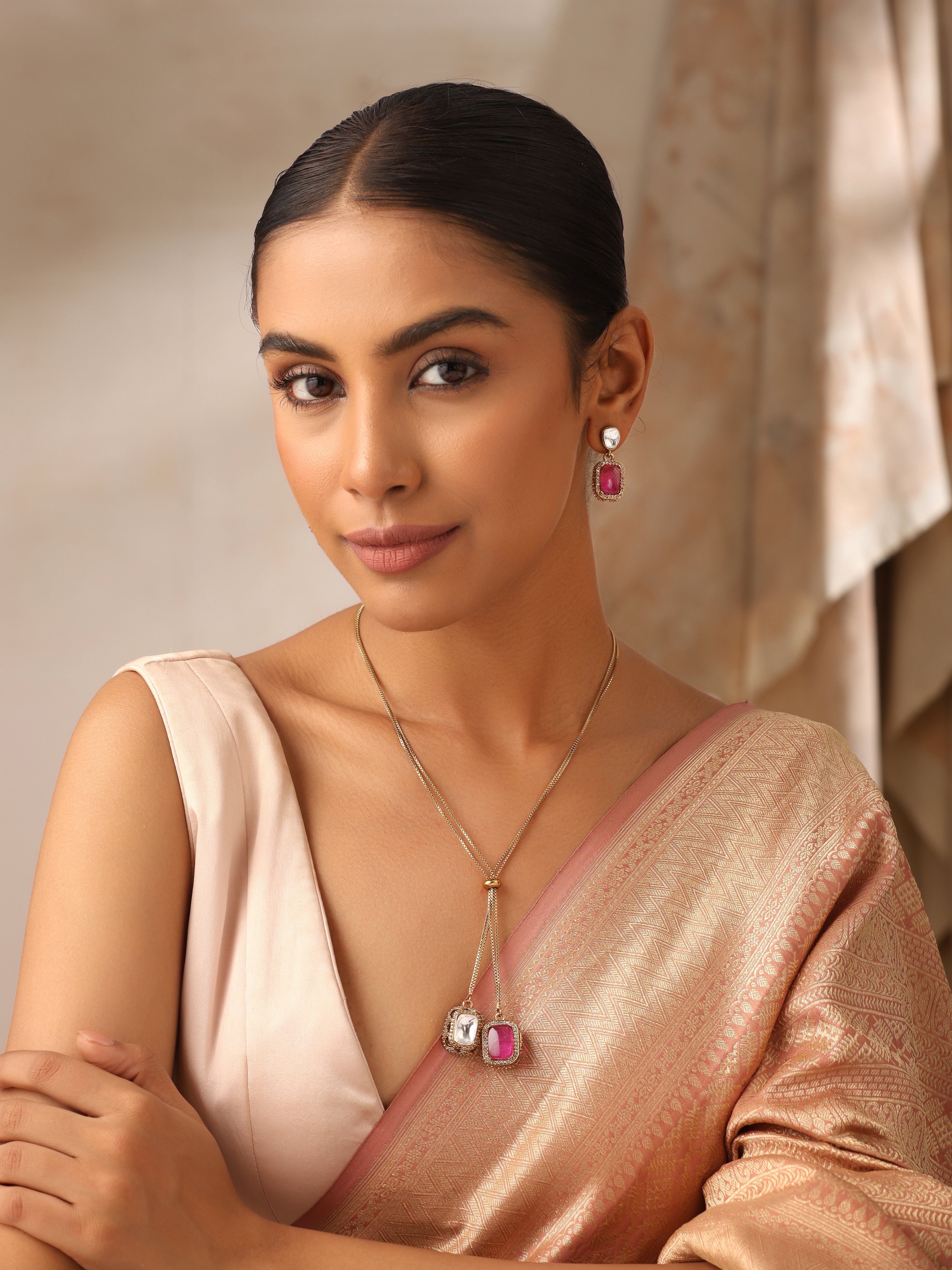 Model wearing Dual Stone Ruby & Polki Pendant Set – Gold Plated Adjustable Chain