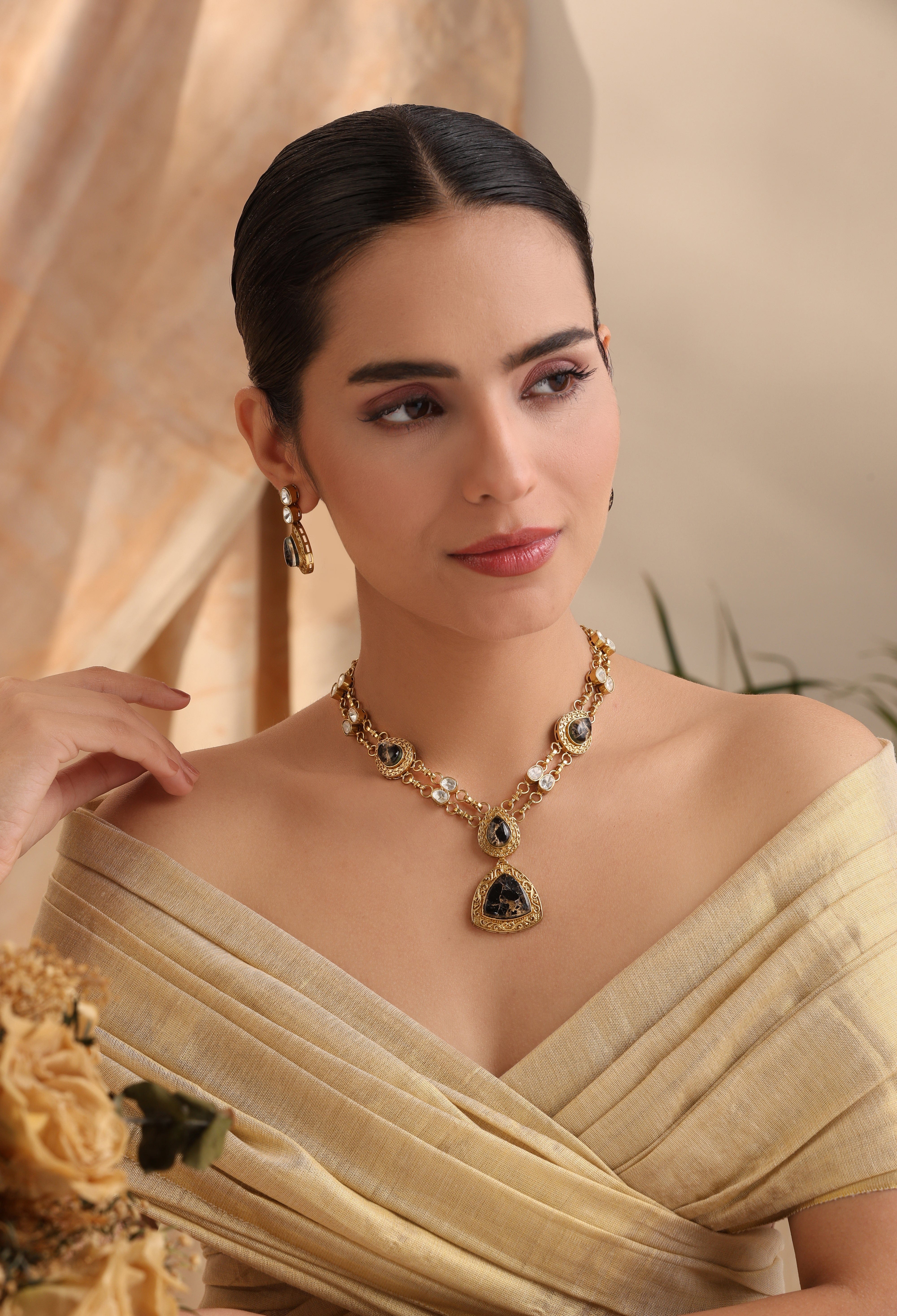 Aarini Black Stone Kundan Necklace Set | Antique Gold Finish with Earrings