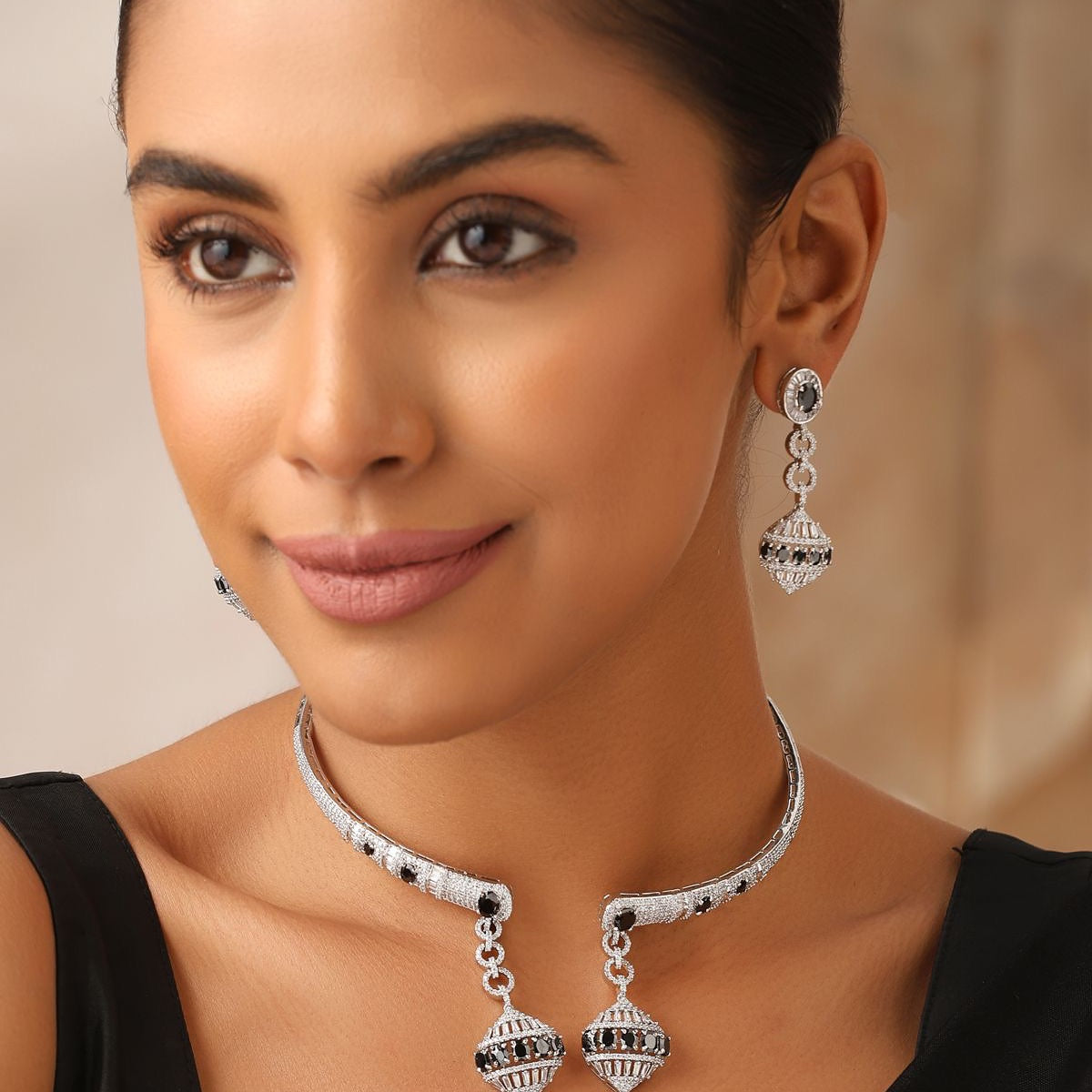 Model wearing Noir Charm black and silver CZ choker necklace with earrings