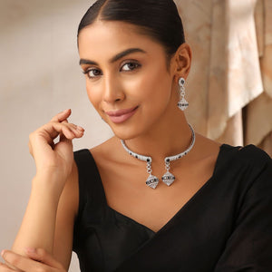 Noir Charm CZ choker set displayed on flatlay with earrings