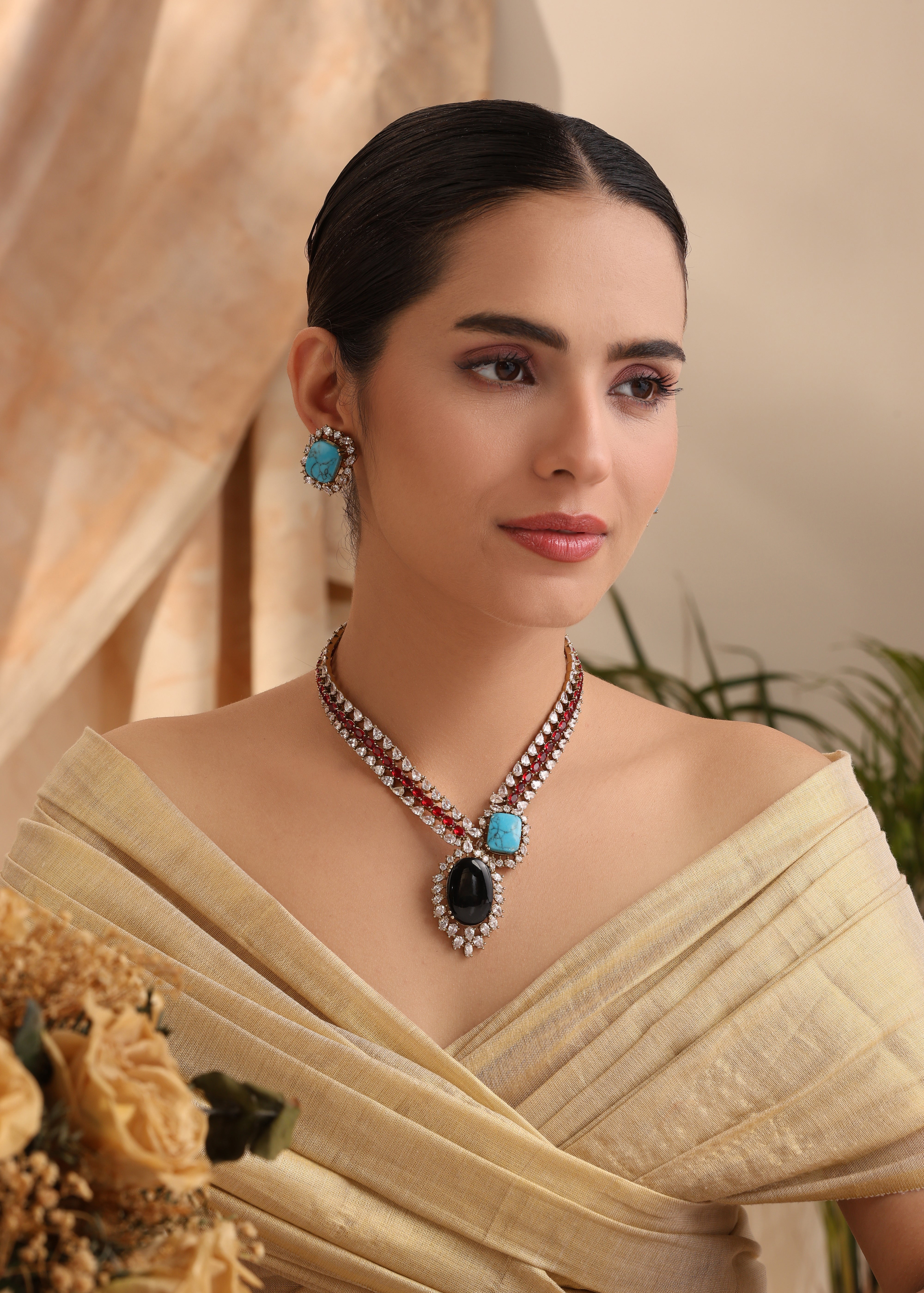 Model wearing Seraphi Turquoise & Black Onyx Necklace Set with CZ diamonds and matching turquoise earrings – MyRivaaz.