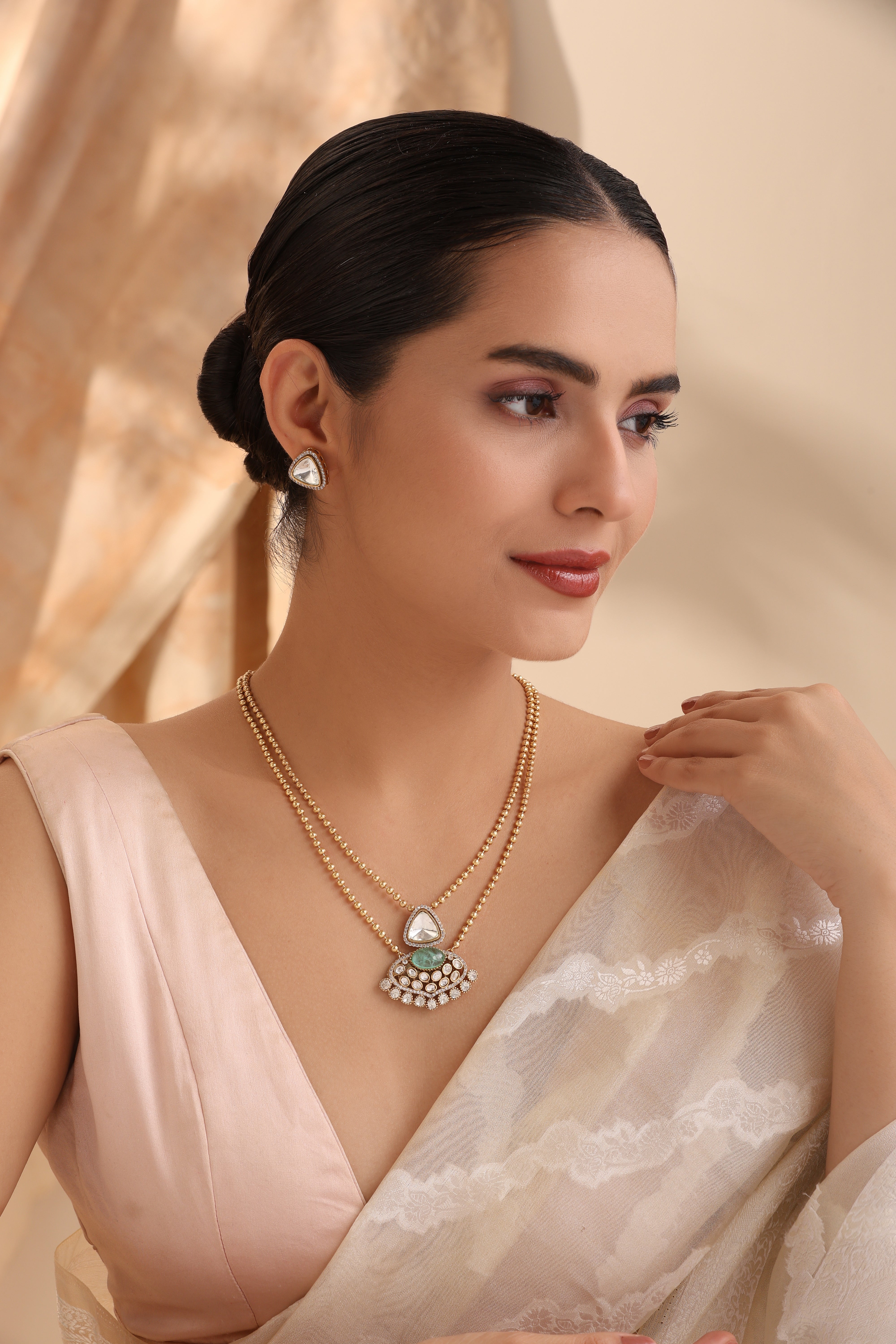 Model wearing Ishani Kundan & Moissanite Pendant Set with double-layer chain Indian Jewelry