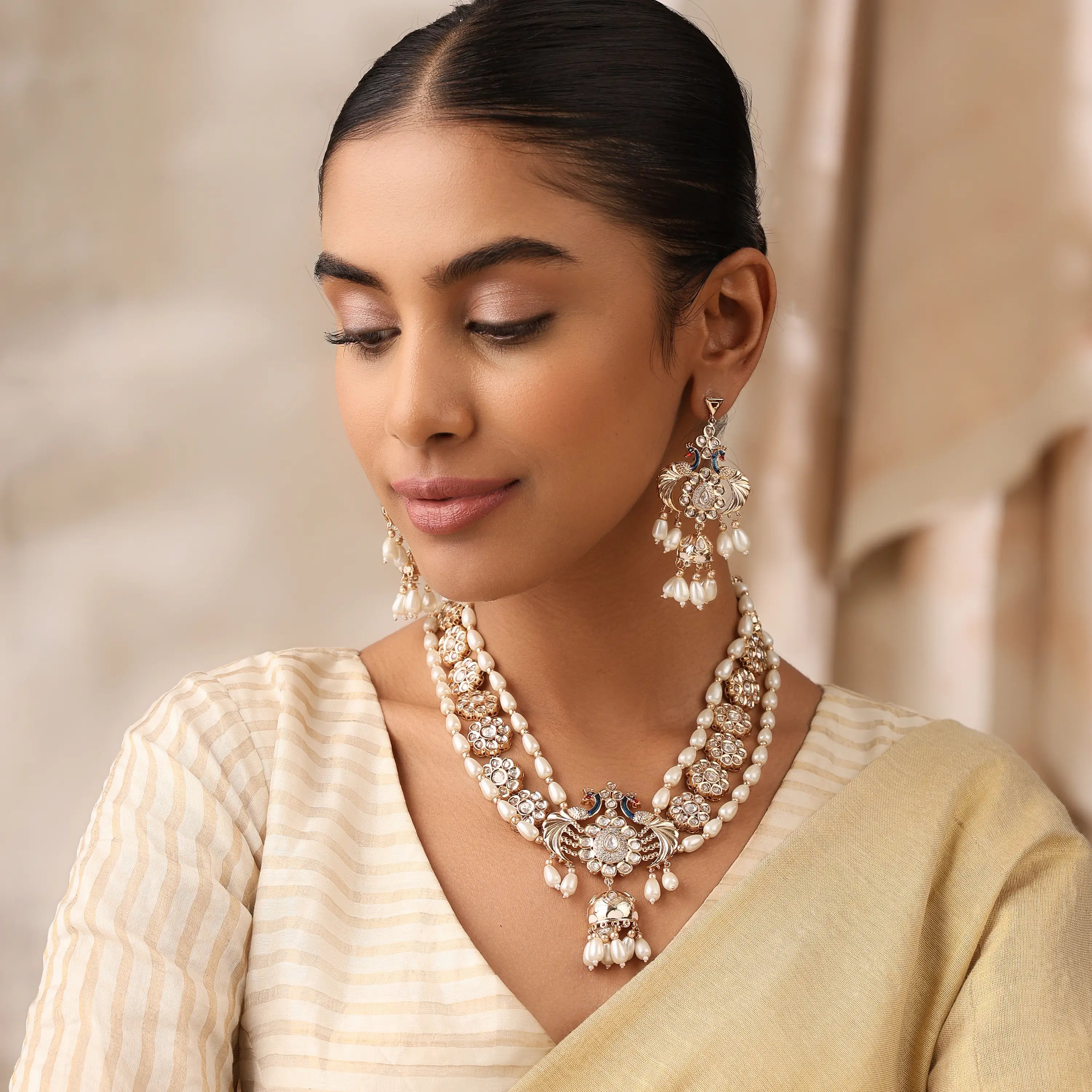 Layered Pearl Kundan Necklace with Peacock Motif & Statement Earrings