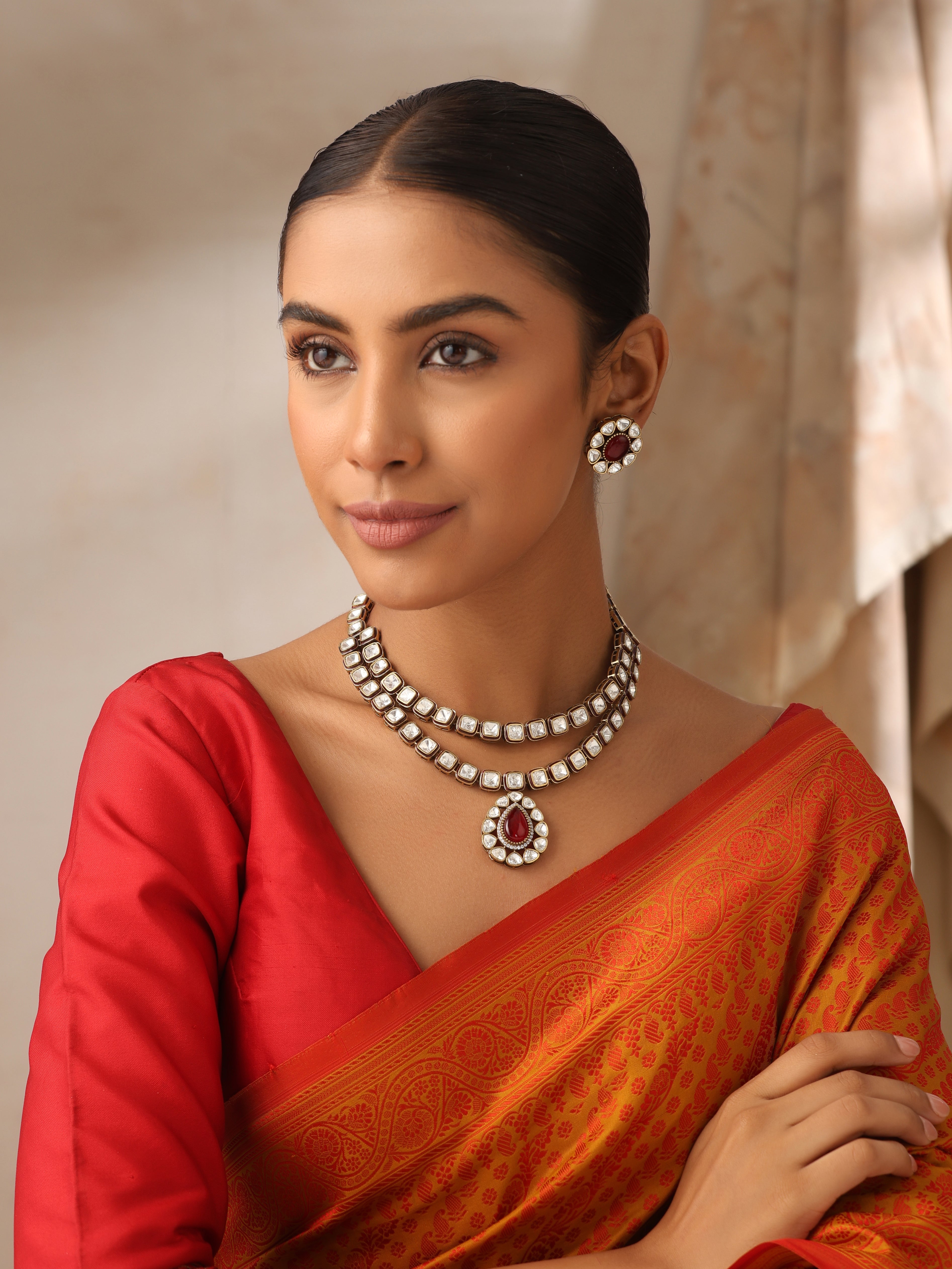 Noorika double layer Kundan necklace front view with ruby drop pendant