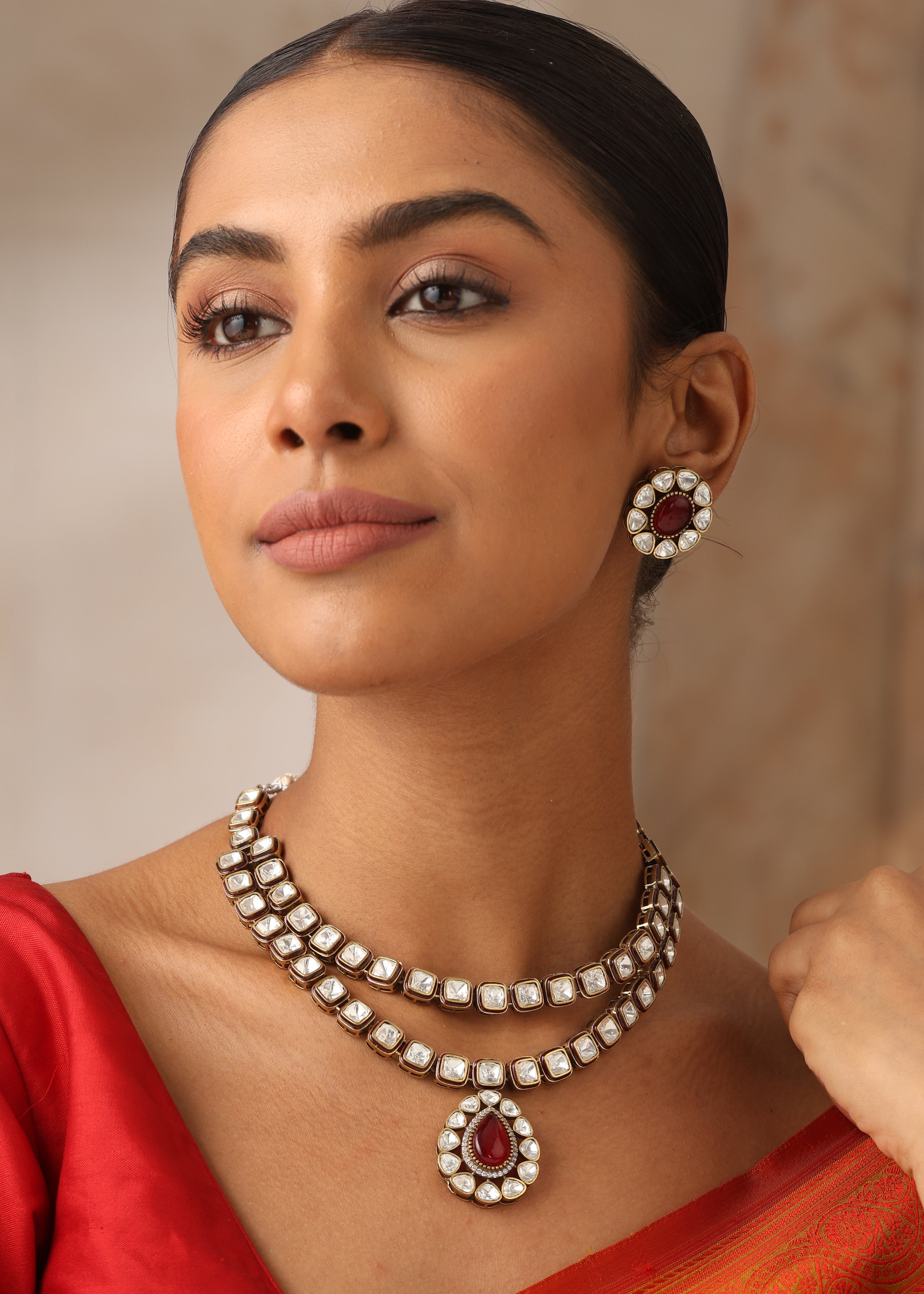 Noorika double layer Kundan necklace front view with ruby drop pendant